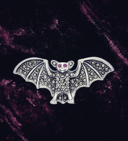 Ruby and marcasite bat brooch in sterling silver