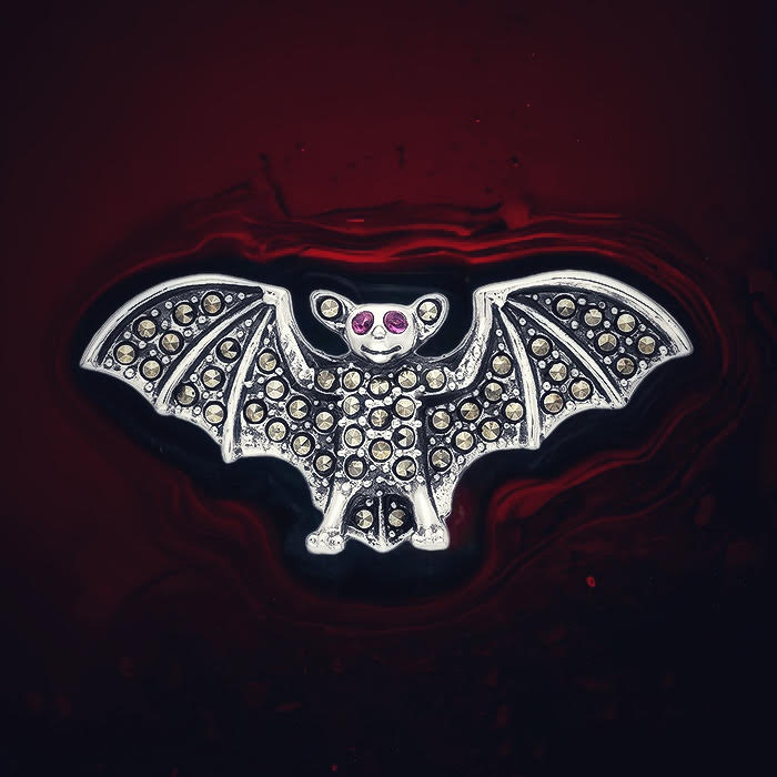 Ruby and marcasite bat brooch in sterling silver