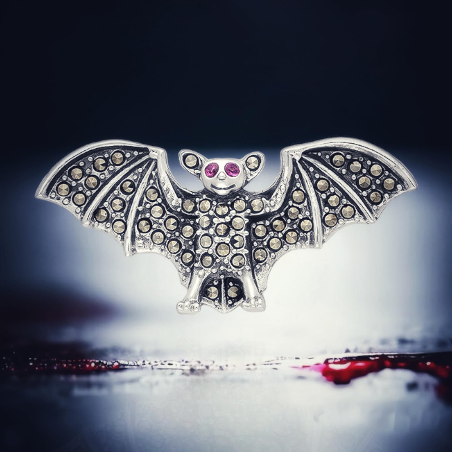 Ruby and marcasite bat brooch in sterling silver